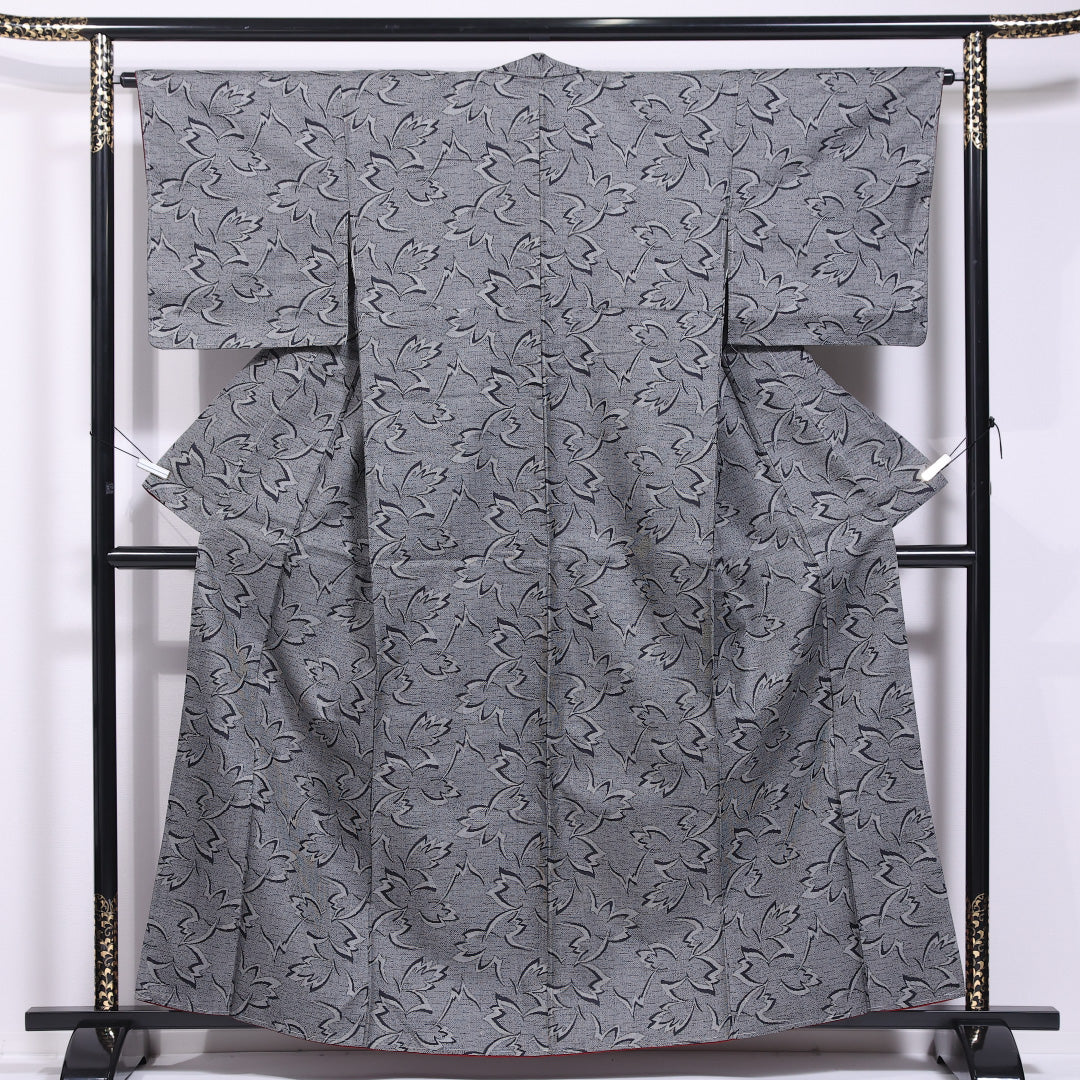 未使用品 本場大島紬 袷 身丈160cm 裄丈64cm 正絹 Nランク インフォーマル 広衿 Lサイズ しつけ糸 植物柄 グレー系 PO 1223-11633