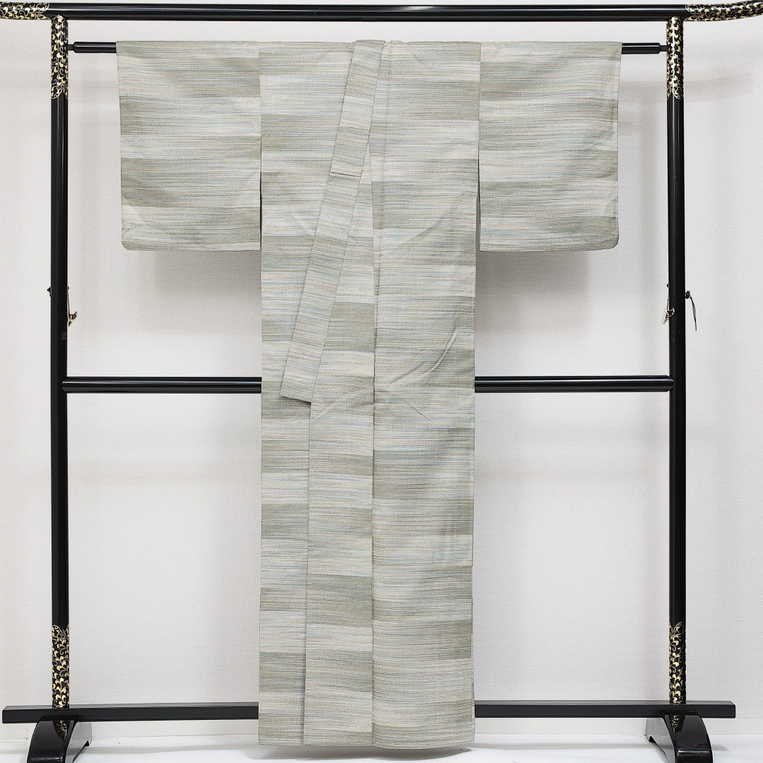 洗える着物 ウールの紬 単衣 身丈159cm 裄丈63cm ウール Sランク カジュアル バチ衿 Mサイズ 肩当て 創作柄 クリーム系 RP 1223-14594