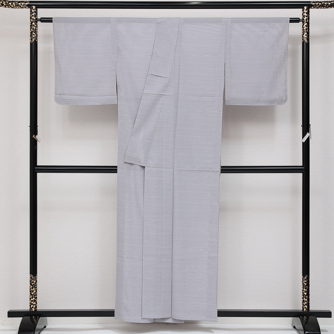 未使用品 色無地 絽 身丈156cm 裄丈62cm Nランク 正絹 広衿 Mサイズ 一つ紋 セミフォーマル 地紋なし しつけ糸 無地 上品 しとやか グレー系 1214-14383