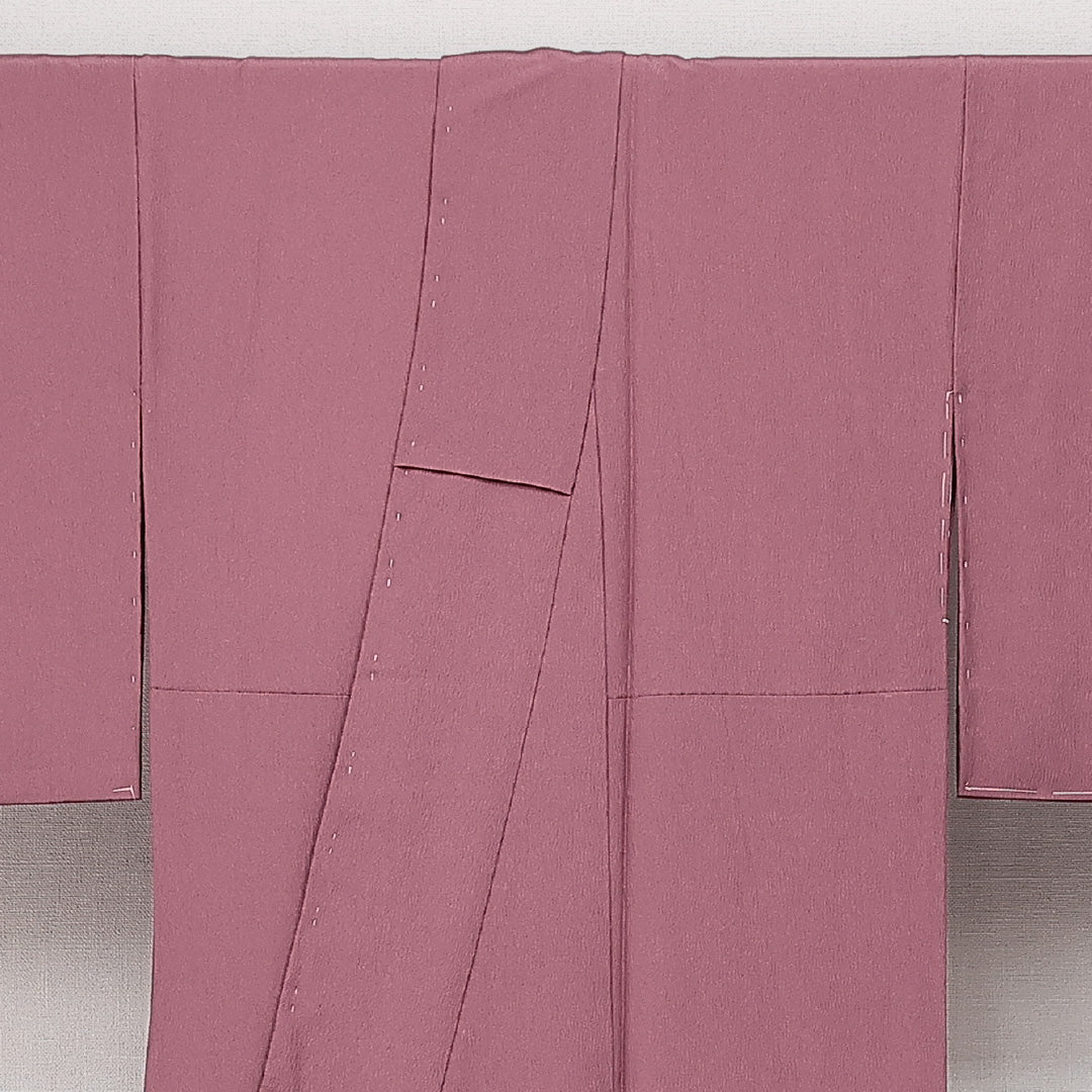 未使用品 色無地 袷 身丈154cm 裄丈62cm 正絹 Sランク 一つ紋 (丸に四つ剣片喰) セミフォーマル 広衿 Sサイズ ふくれ織 しつけ糸 ピンク系 RP 1219-14224