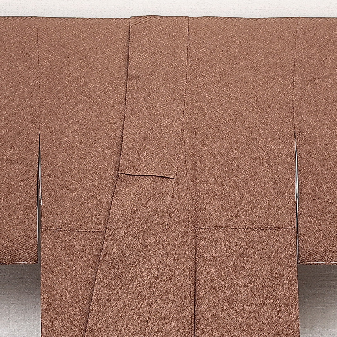 未使用品 江戸小紋 (鮫) 袷 身丈156cm 裄丈64cm 正絹 Nランク 一つ紋 (五三桐) 紋意匠 (紗綾形) セミフォーマル 広衿 Mサイズ 伊勢型 型染め しつけ糸 茶系 M4 1220-14056