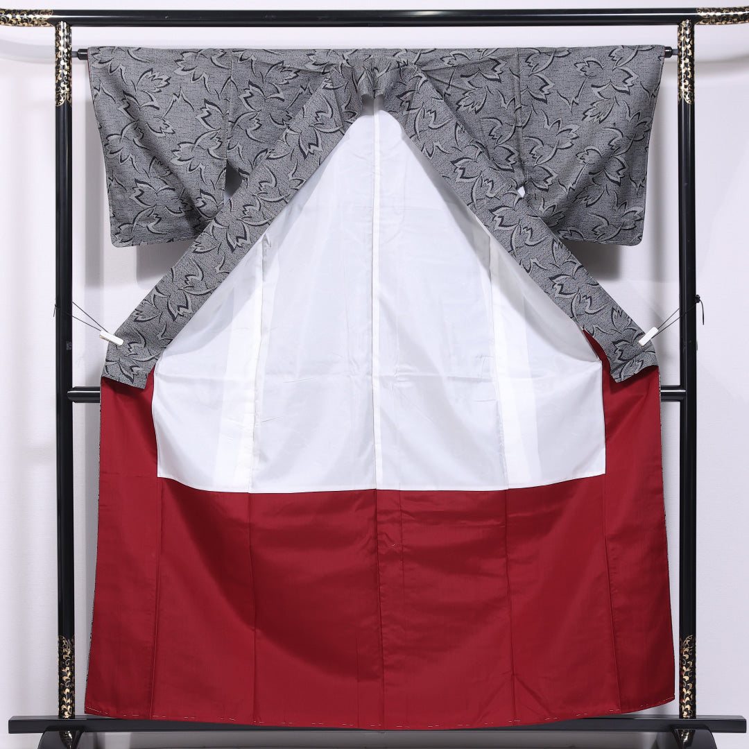 未使用品 本場大島紬 袷 身丈160cm 裄丈64cm 正絹 Nランク インフォーマル 広衿 Lサイズ しつけ糸 植物柄 グレー系 PO 1223-11633