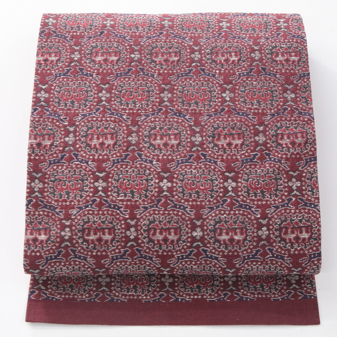 九寸名古屋帯 帯丈328cm カジュアル 名古屋仕立て 六通 Sランク 正絹 名物裂 赤系 1224-04183