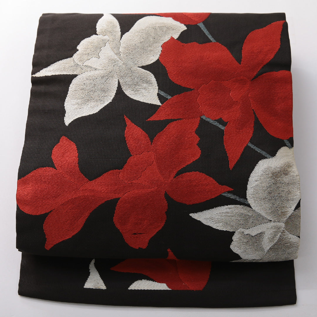 九寸名古屋帯 帯丈359cm カジュアル 名古屋仕立て 六通 Cランク 正絹 綴れ織 百合 黒系 1224-03822