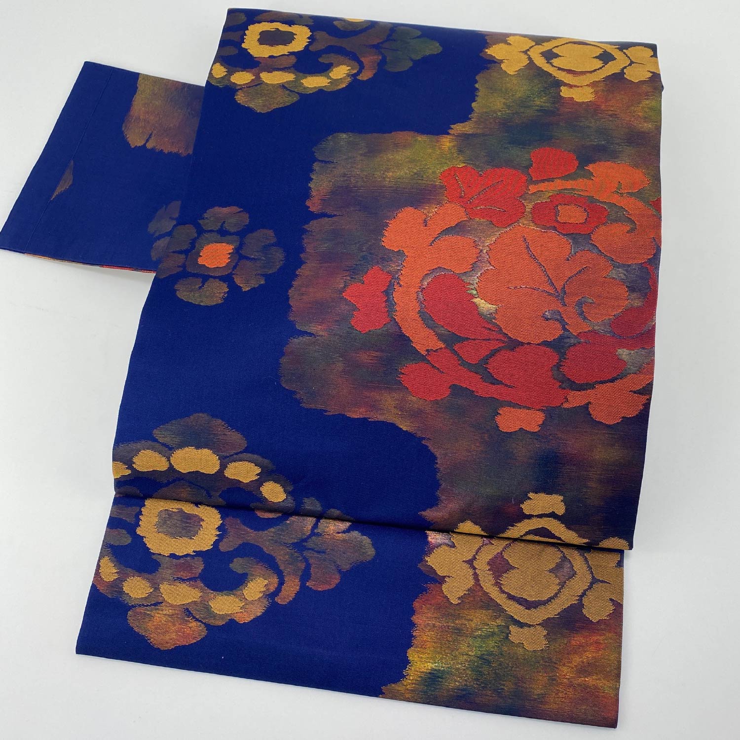 名古屋帯 帯丈323cm 六通 名古屋仕立て Sランク カジュアル 引箔 宝相華 正絹 紺系 1224-00022