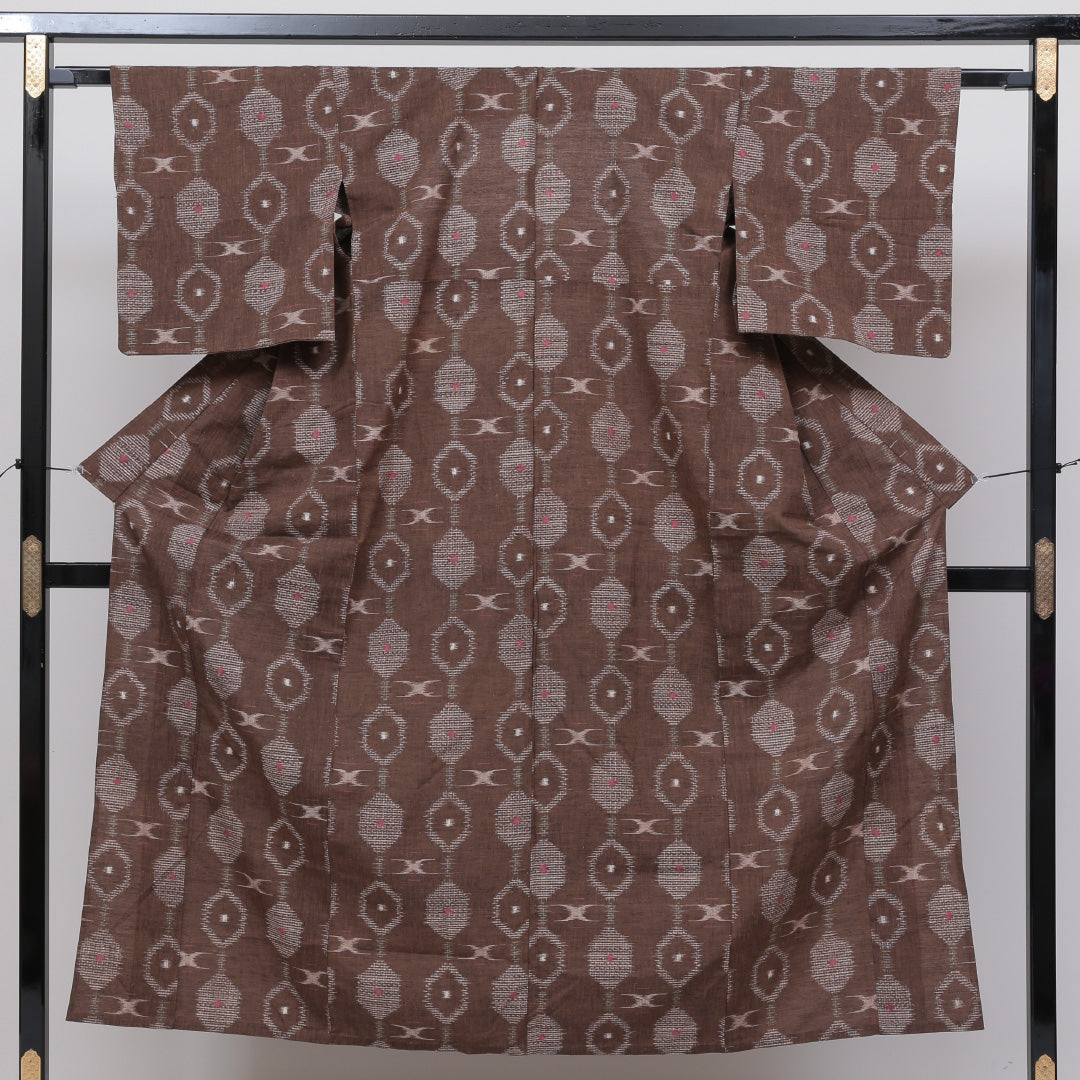 紬 単衣 身丈148cm 裄丈63cm 正絹 Sランク XSサイズ バチ衿 カジュアル 亀甲 茶系 1216-02576