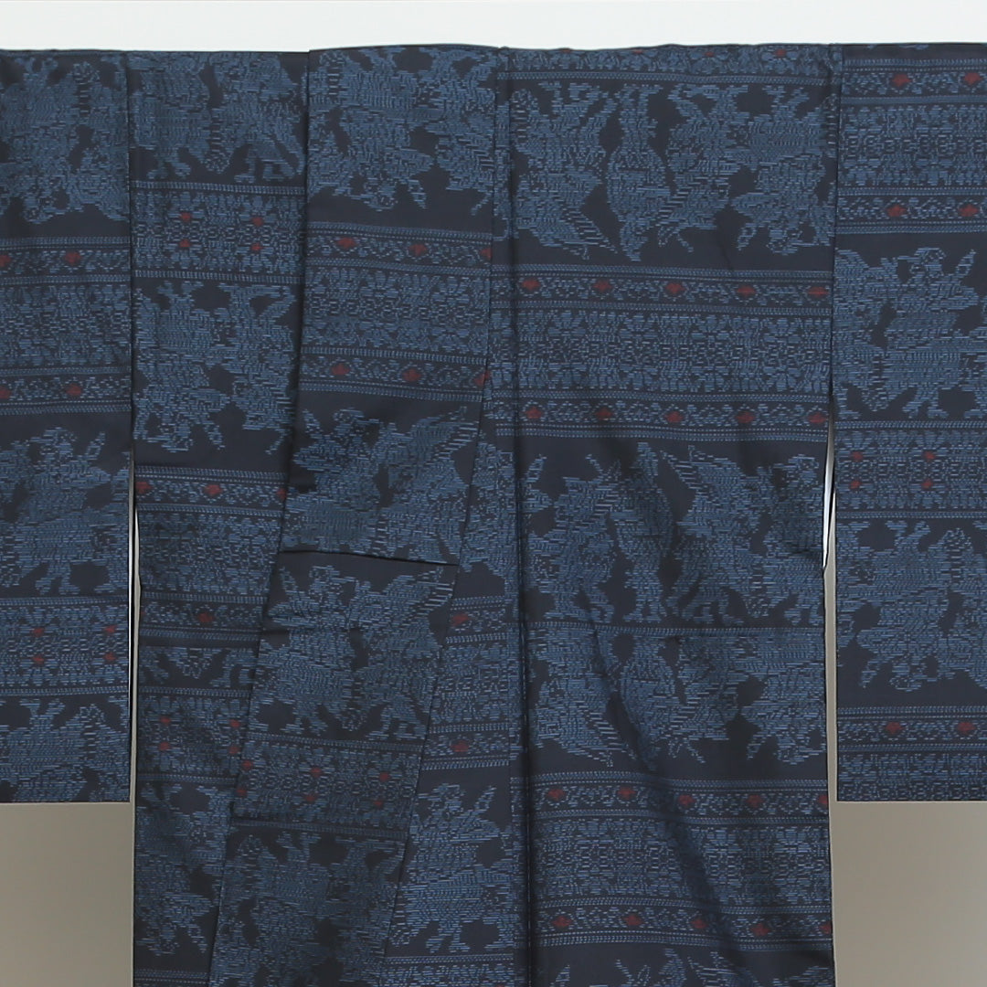 紬(大島紬) 袷 身丈153cm 裄丈64cm 正絹 Sランク Sサイズ 広衿 インフォーマル 緯総絣 コプト柄 紺系 1216-02699