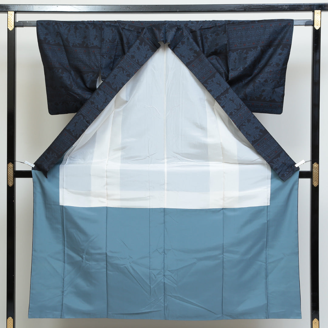 紬(大島紬) 袷 身丈153cm 裄丈64cm 正絹 Sランク Sサイズ 広衿 インフォーマル 緯総絣 コプト柄 紺系 1216-02699