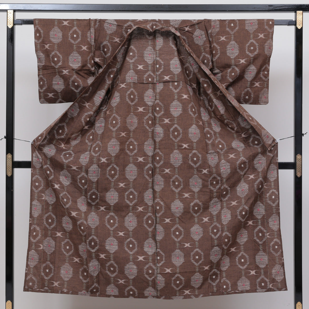 紬 単衣 身丈148cm 裄丈63cm 正絹 Sランク XSサイズ バチ衿 カジュアル 亀甲 茶系 1216-02576