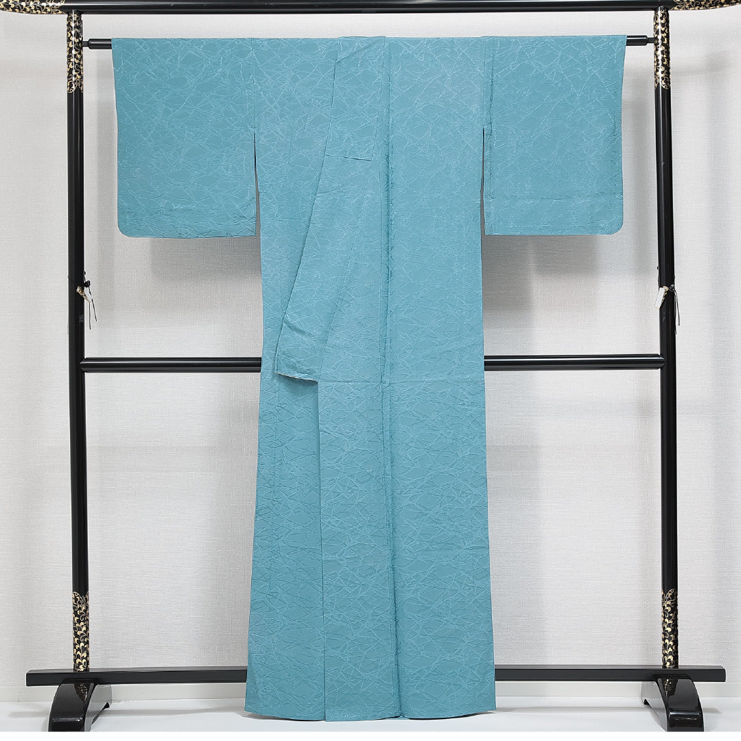 色無地 単衣 身丈162cm 裄丈65cm 正絹 Sランク Lサイズ 広衿 一つ紋（丸に片喰） セミフォーマル 紋意匠 抽象柄 織り出し 青系 1214-14769