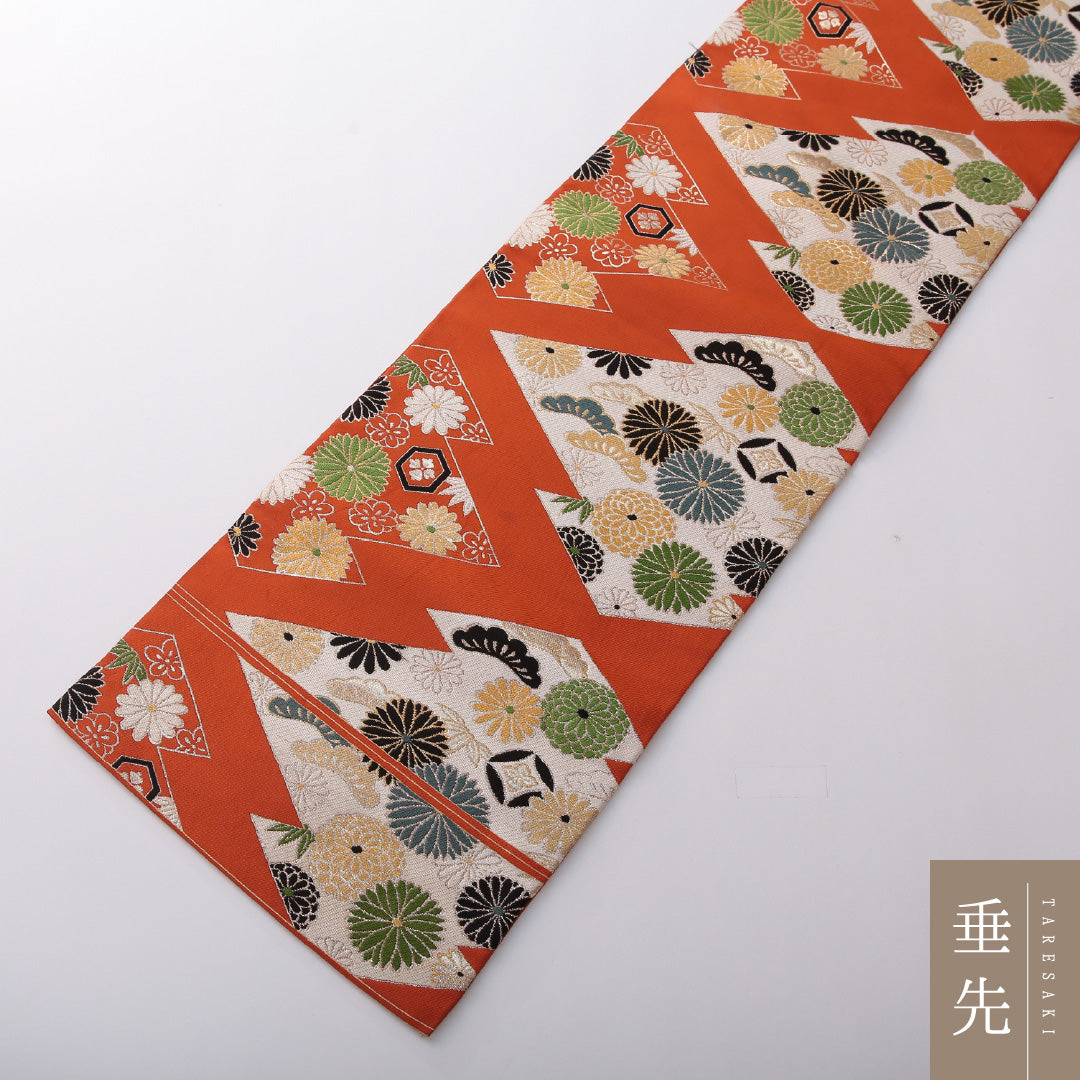九寸名古屋帯 帯丈335cm カジュアル 名古屋仕立て 六通 Cランク 正絹 松皮菱 菊 松葉 朱系 1224-03602