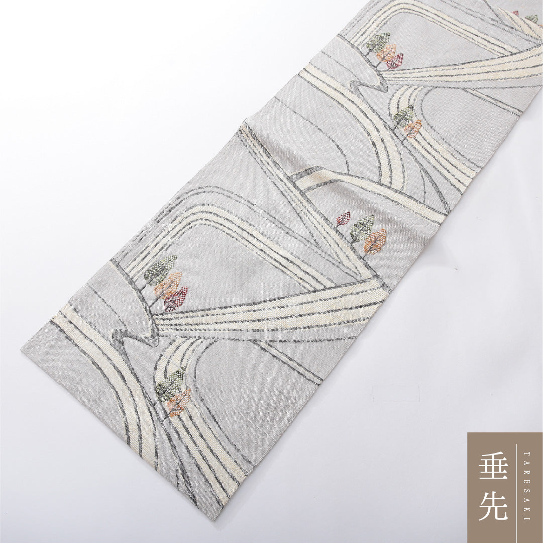 八寸名古屋帯（紬） 帯丈351cm カジュアル 松葉仕立て 六通 Cランク 正絹 創作柄 グレー系 1224-03901