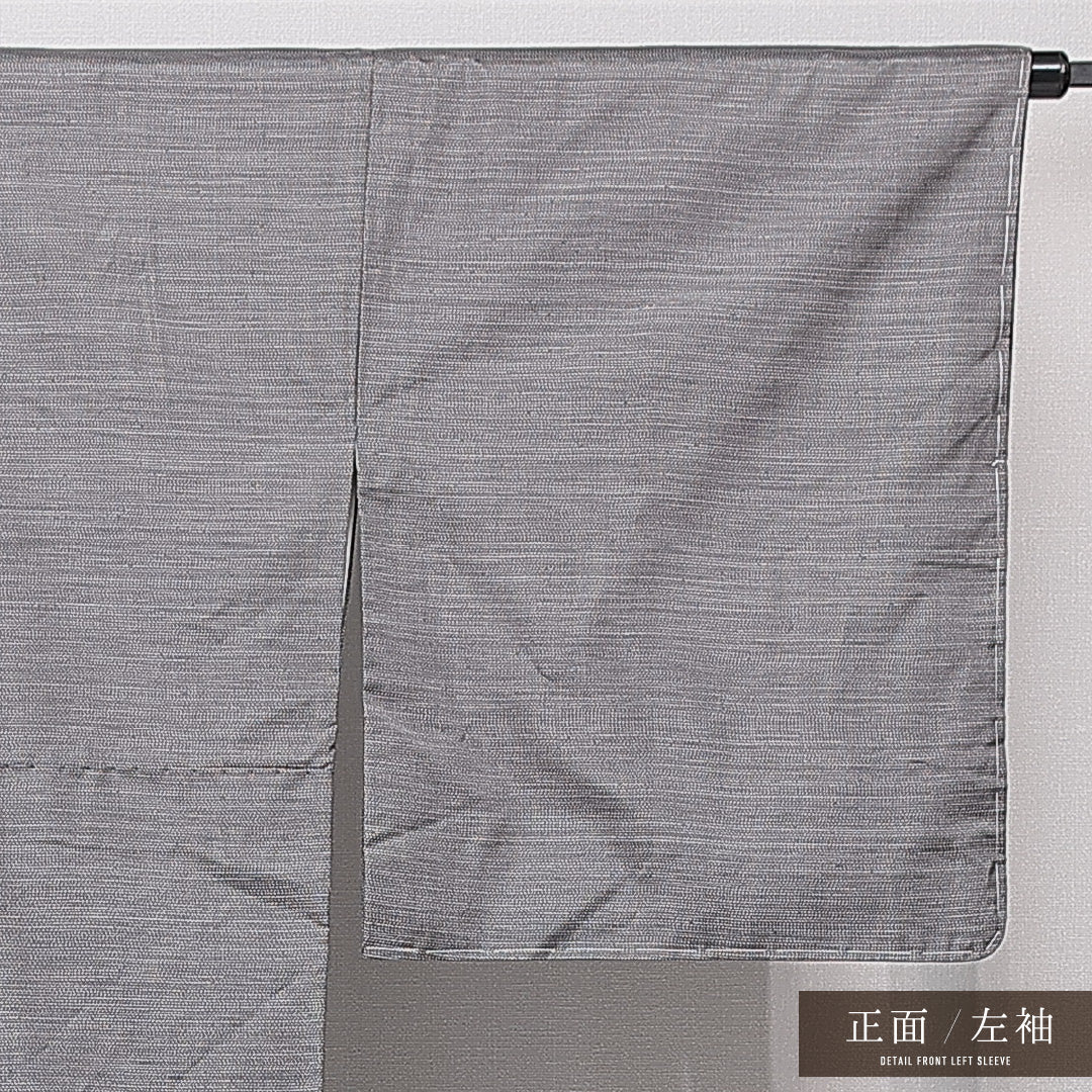 未使用品 大島紬 袷 身丈170cm 裄丈68cm 正絹 Nランク インフォーマル 広衿 2XLサイズ 経緯絣 染め紬 ガード加工 しつけ糸 雪輪 グレー系 PO 1223-15043