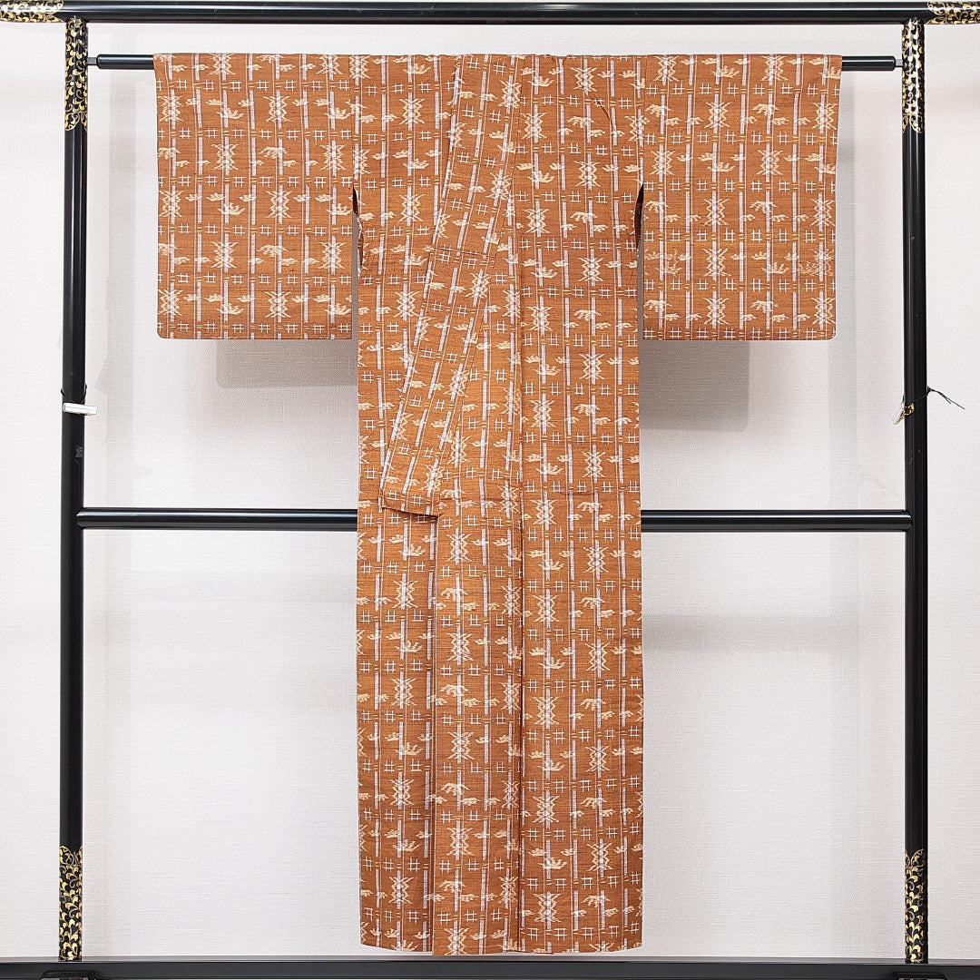 紬 単衣 身丈149cm 裄丈62cm 正絹 Sランク カジュアル 広衿 XSサイズ 十字絣 創作柄 茶系 RP 1223-15330