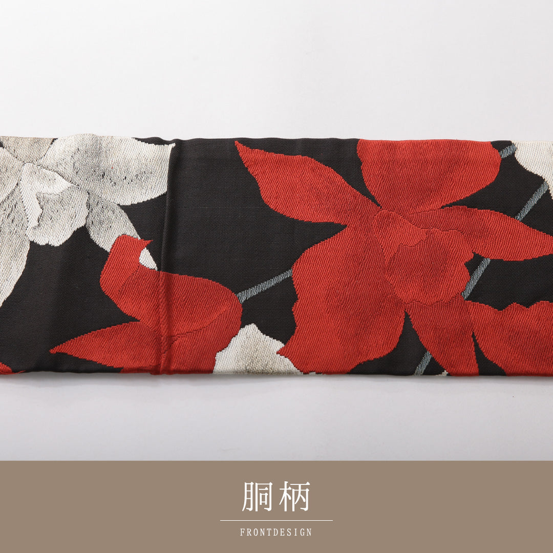 九寸名古屋帯 帯丈359cm カジュアル 名古屋仕立て 六通 Cランク 正絹 綴れ織 百合 黒系 1224-03822