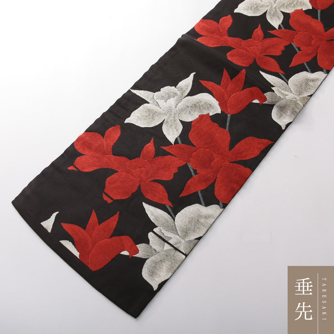 九寸名古屋帯 帯丈359cm カジュアル 名古屋仕立て 六通 Cランク 正絹 綴れ織 百合 黒系 1224-03822