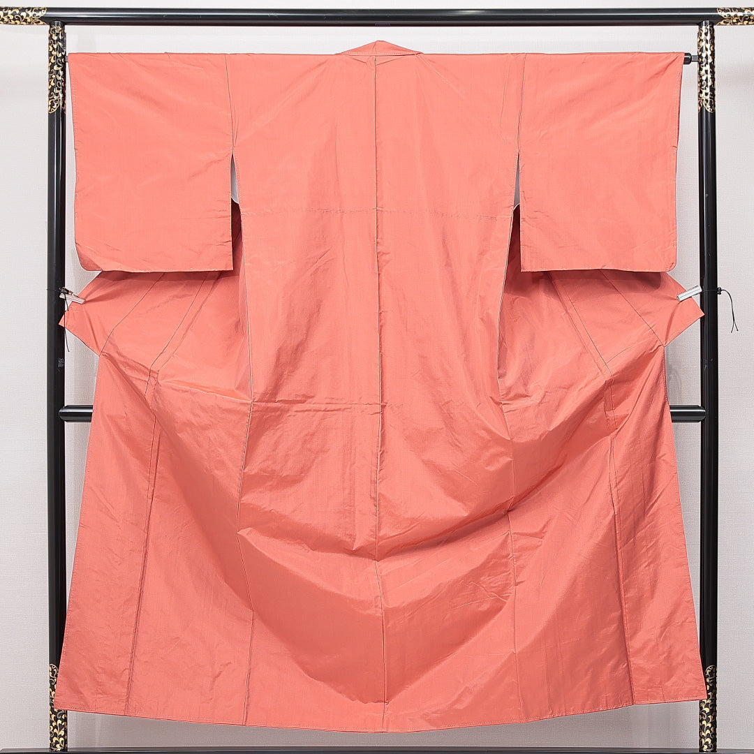 未使用品 紬 袷 身丈155cm 裄丈65cm 正絹 Nランク カジュアル 広衿 Mサイズ しつけ糸 無地 朱系 RP 1223-15111